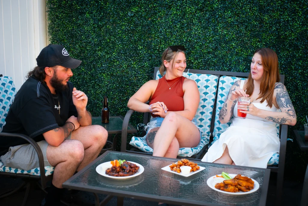 Friends talking together on the Lodge patio